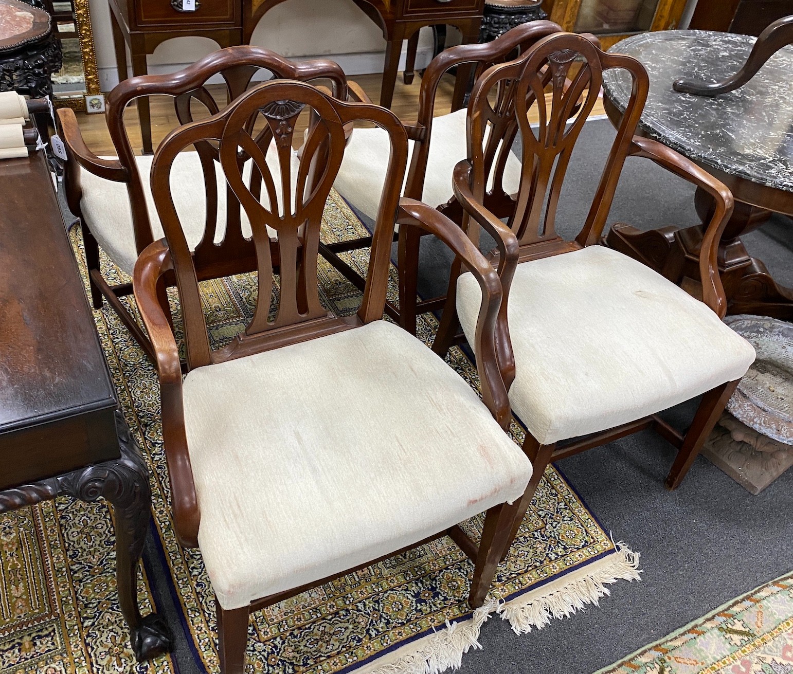A set of ten George III style mahogany dining chairs